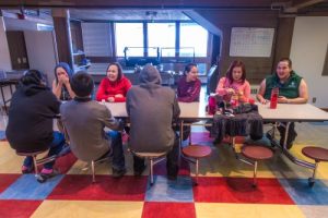 Students relax after a day of classes in the Sacket Hall dining room on UAF's Kuskokwim Campus in Bethel.