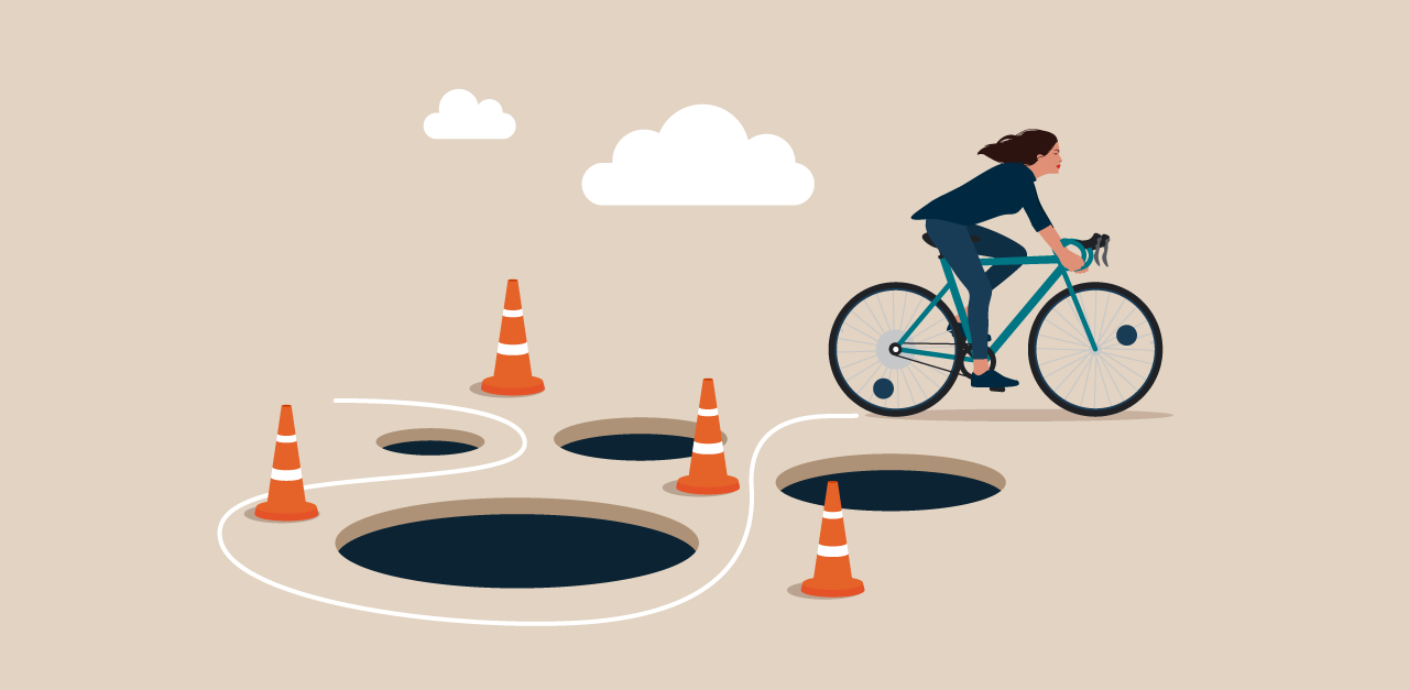 Animation of a person riding a bike around holes in the ground to illustrate Potential Pitfalls for Your Work in an LMS