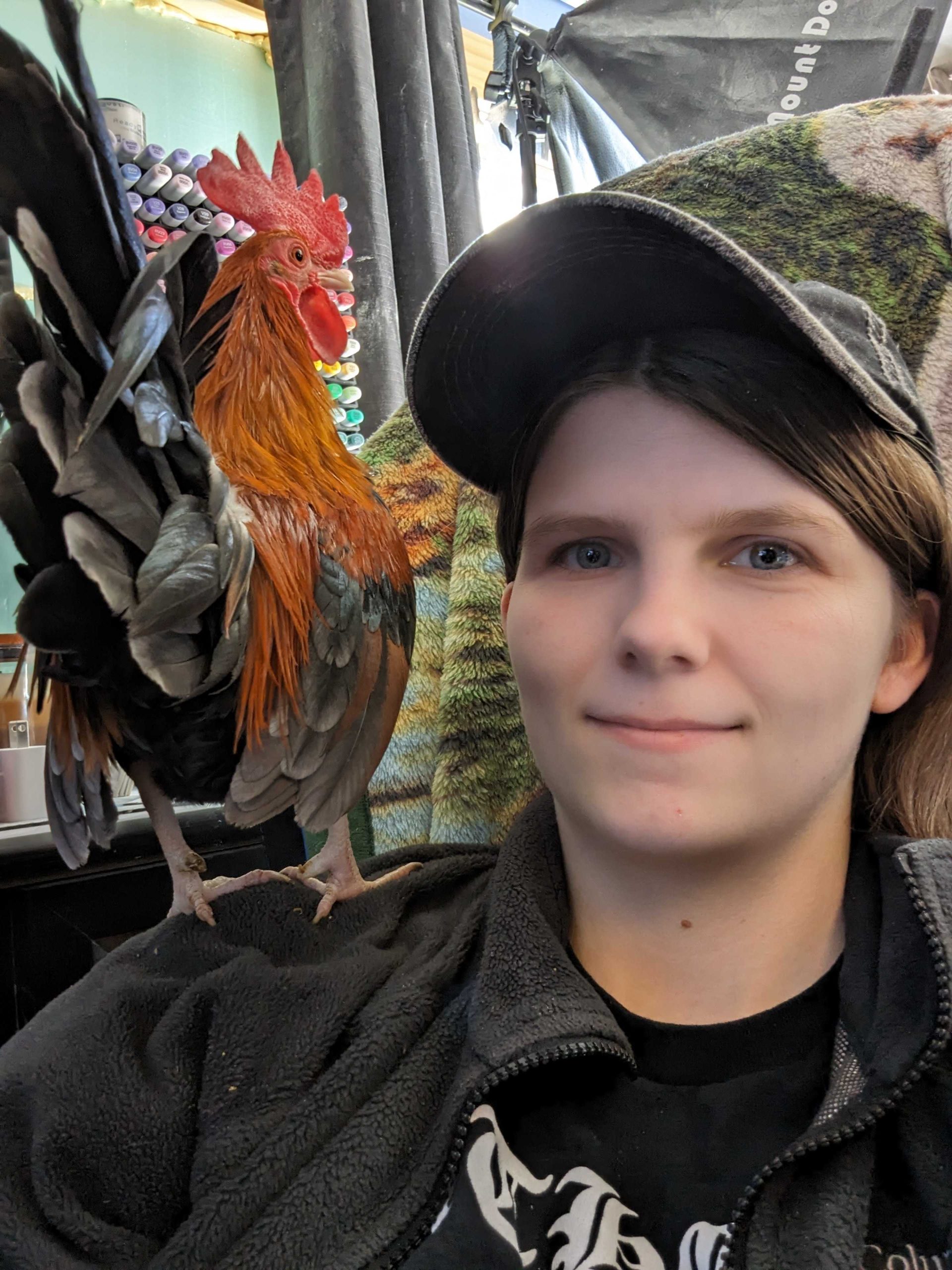 Staff Spotlight: Shayla Sackinger, a photo of Shayla and her chicken Bran (aka Little Man)